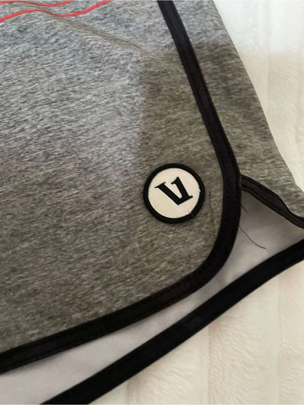 Vuori Men's Swim Shorts in Black with Dusty Rose Accent
